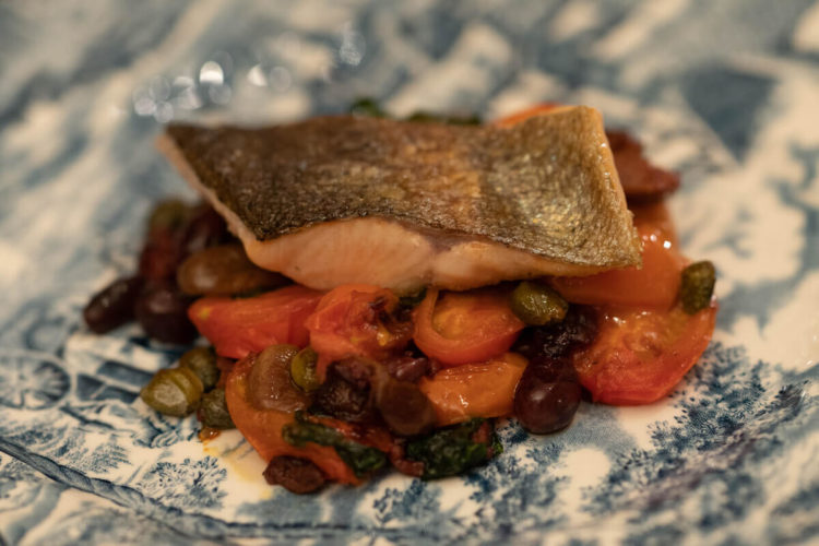 Trout, olives, tomatoes and a side of spinach