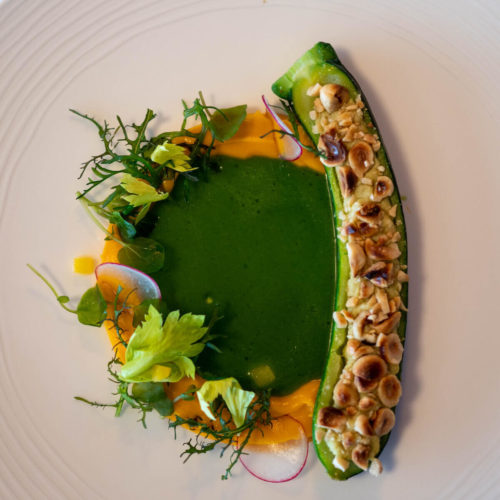 Courgette with almonds and  tofu,carrot cream and lovage